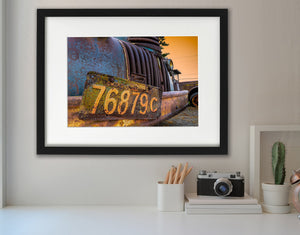 Vintage Ontario plate mounted across a heavily corroded farm-truck bumper