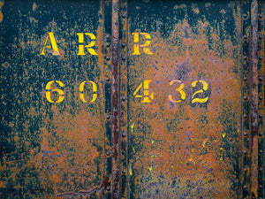 Antique rail car with extensive rust