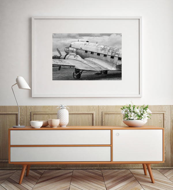 Rusted and abandoned military plane in black-and-white photography