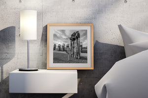 Half‑buried VW Beetles wrapped in spray paint tags