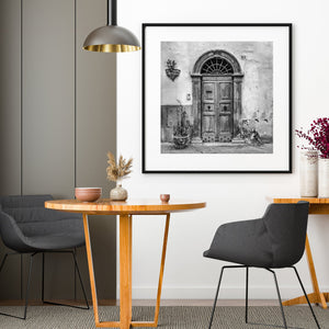 Spoleto doorway with ornate iron grille