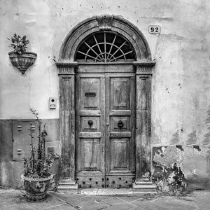 Old wooden doorway with stone arch