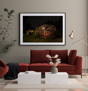 Gritty nighttime wall art of old buses left to time and rust