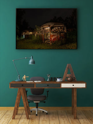 Industrial wall art featuring rusted public transit vehicles at rest