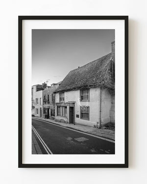 Historic Rye street and steep tiled roof in black and white