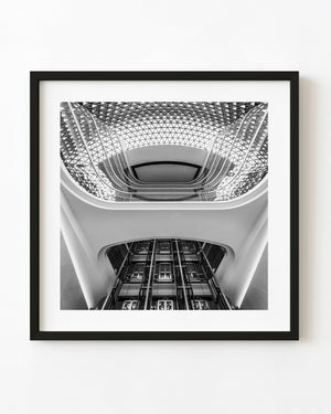 SAHMRI atrium with curved balconies and geometric glazing in black and white
