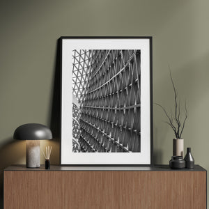 Angled interior wall with metal framing and patterned glass