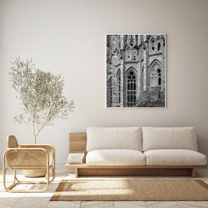 Tall Gothic-inspired windows above leafy branches in Barcelona