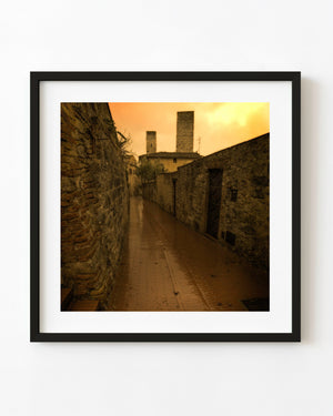 Empty stone lane in San Gimignano with warm sepia tones