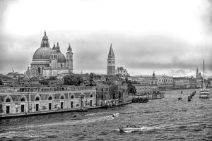 Venice waterfront with domed Santa Maria della Salute and passing boats