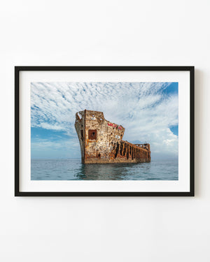 Sapona shipwreck rising from blue water at Bimini