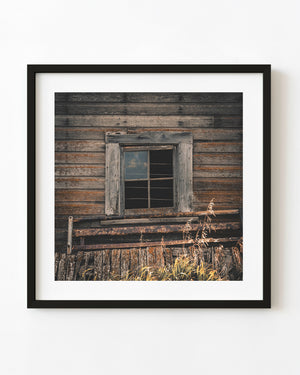 Weathered Saskatchewan farmhouse window in muted colour