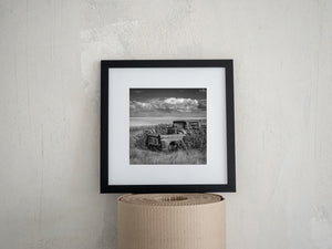 Black and white prairie landscape with abandoned rural truck