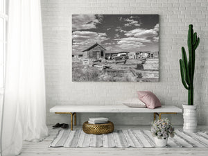 Monochrome rural Nevada scene with deserted vehicles