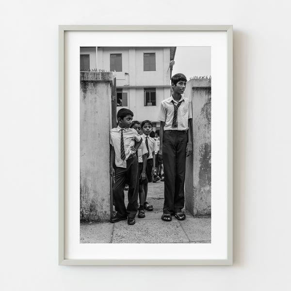 Schoolboys standing outside school Kochi India