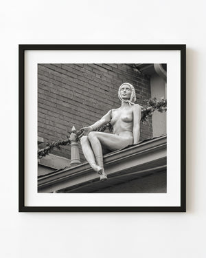 Seated Toronto rooftop mannequin in black and white