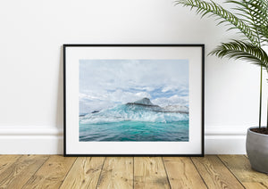 Blue ice formations with dark layers and snowy peaks beyond