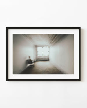 Sepia motion-blur interior with a chair and bright window