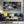 Tokyo street signs and storefronts behind blurred crossing crowds