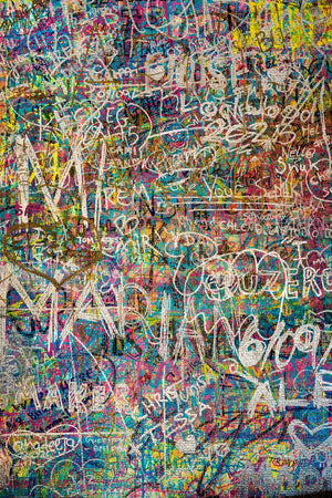 Large white tags crossing turquoise pink and yellow paint