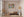 Bright graffiti-covered wall with white vodka lettering and scattered tags