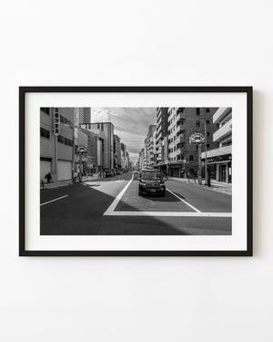 Shinjuku avenue and taxi in black and white