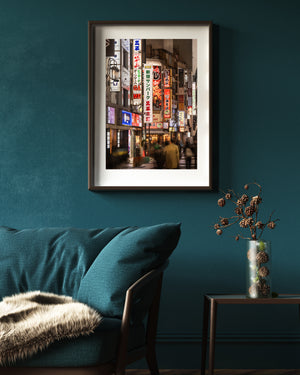 Tokyo nightlife photograph with dense signage and softly blurred figures