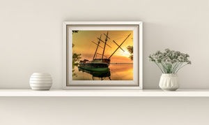 Historic shipwreck La Grande Hermine under golden sky