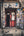 Red doorway painted with two cartoon figures beneath a pigeon mural