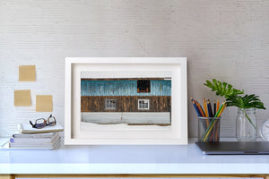 Ontario barn in winter with falling snow