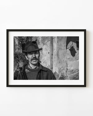 Sighisoara man in a broad hat in black and white