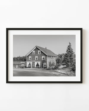 Silver Islet general store beside the water in black and white