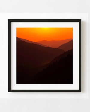 Smoky Mountains ridges silhouetted beneath a brilliant orange sky