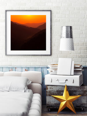 Smoky Mountains ridgelines beneath a vivid orange sky