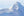Rounded Antarctic peak with smooth snow and pale blue shadow