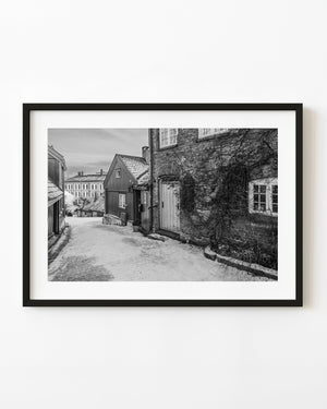 Snowy Oslo lane with wooden houses in black and white