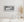 Panoramic monochrome view of an abandoned gas station facade