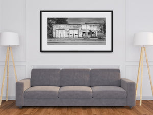 Black and white architectural photograph of a neglected Indiana garage