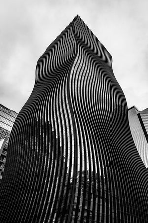 Black and white view of twisting skyscraper architecture
