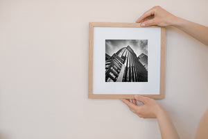 Black and white photo of curved glass tower in Seoul