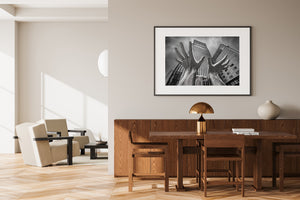 Upward angle of modern skyscraper behind public art installation