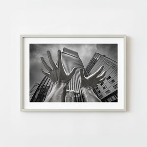 Large sculpture hands reaching upward in front of Garak Tower East Seoul