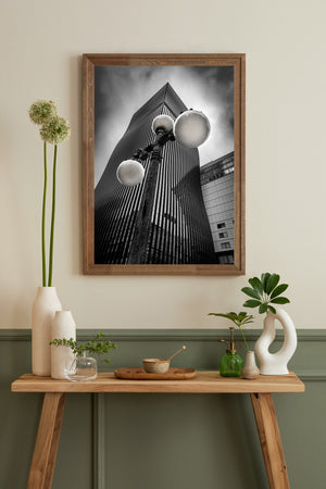 Urban architectural detail featuring curved tower and lamp