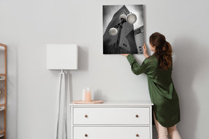 Dramatic black and white city architecture with street lamp