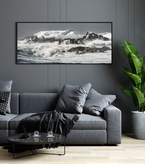 Rough Southern Ocean water crashing against a frozen Antarctic coast