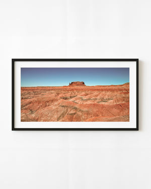 Southwest desert ridges and a distant red butte