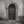 Paneled Italian doorway with a semicircular iron fanlight in Spoleto.