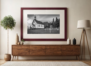 Historic Ontario church with pointed windows beneath a textured sky.