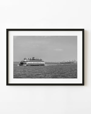 Staten Island Ferry crossing New York Harbor in black and white.
