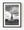 Statue of Liberty and Liberty Island beneath dramatic clouds in black and white.